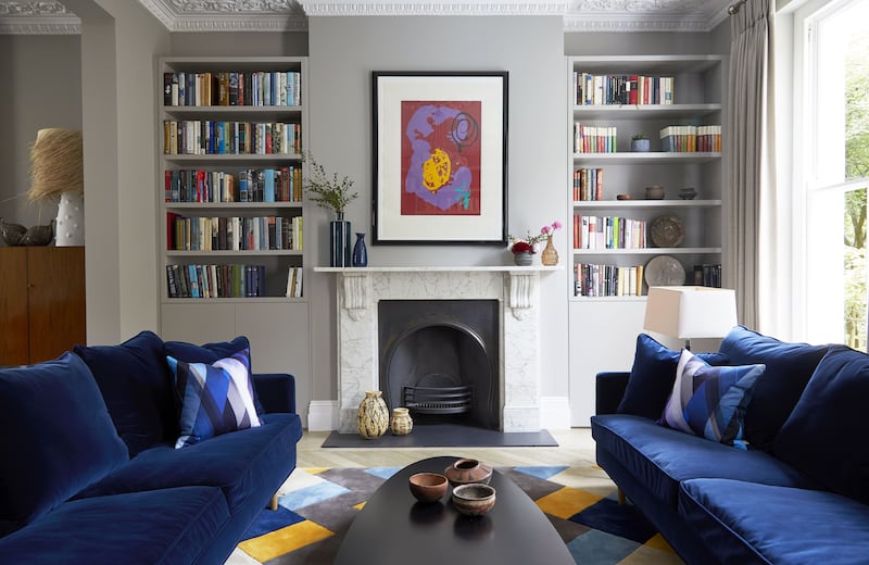 A striking modern living room is filled with characterful elements that add personality and warmth to the space