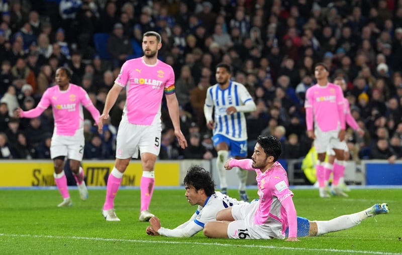 Kaoru Mitoma, centre, scores Brighton’s opener