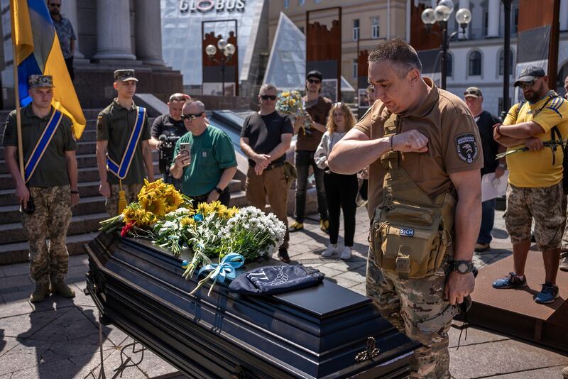 Comrades of Peter Fouche at the funeral in Kyiv (Alex Babenko/AP)