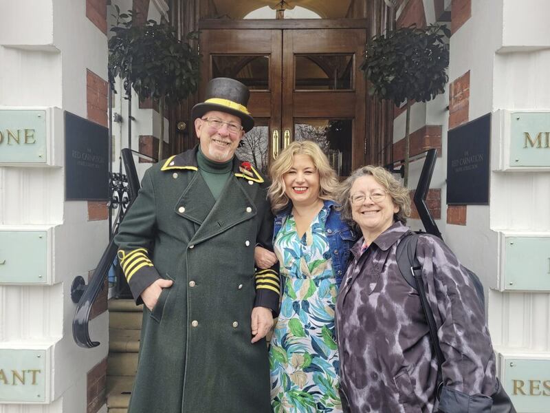 Emma and Maria with doorman Tim on their reluctant departure from The Milestone Hotel 