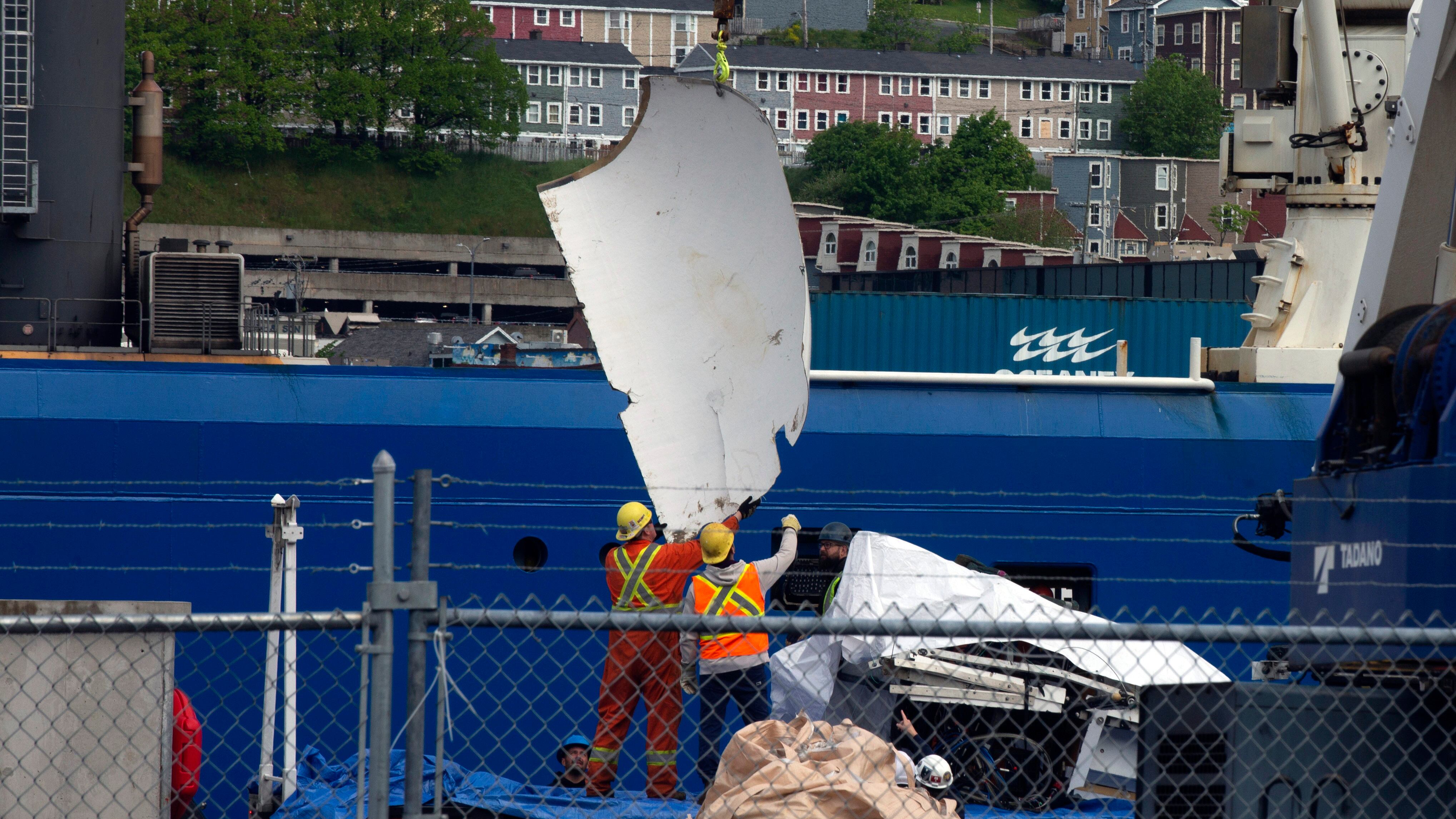 Debris from the Titan submersible, recovered from the ocean floor near the wreck of the Titanic, is unloaded from the ship Horizon Arctic at the Canadian Coast Guard pier in Newfoundland (Paul Daly/The Canadian Press via AP/File)