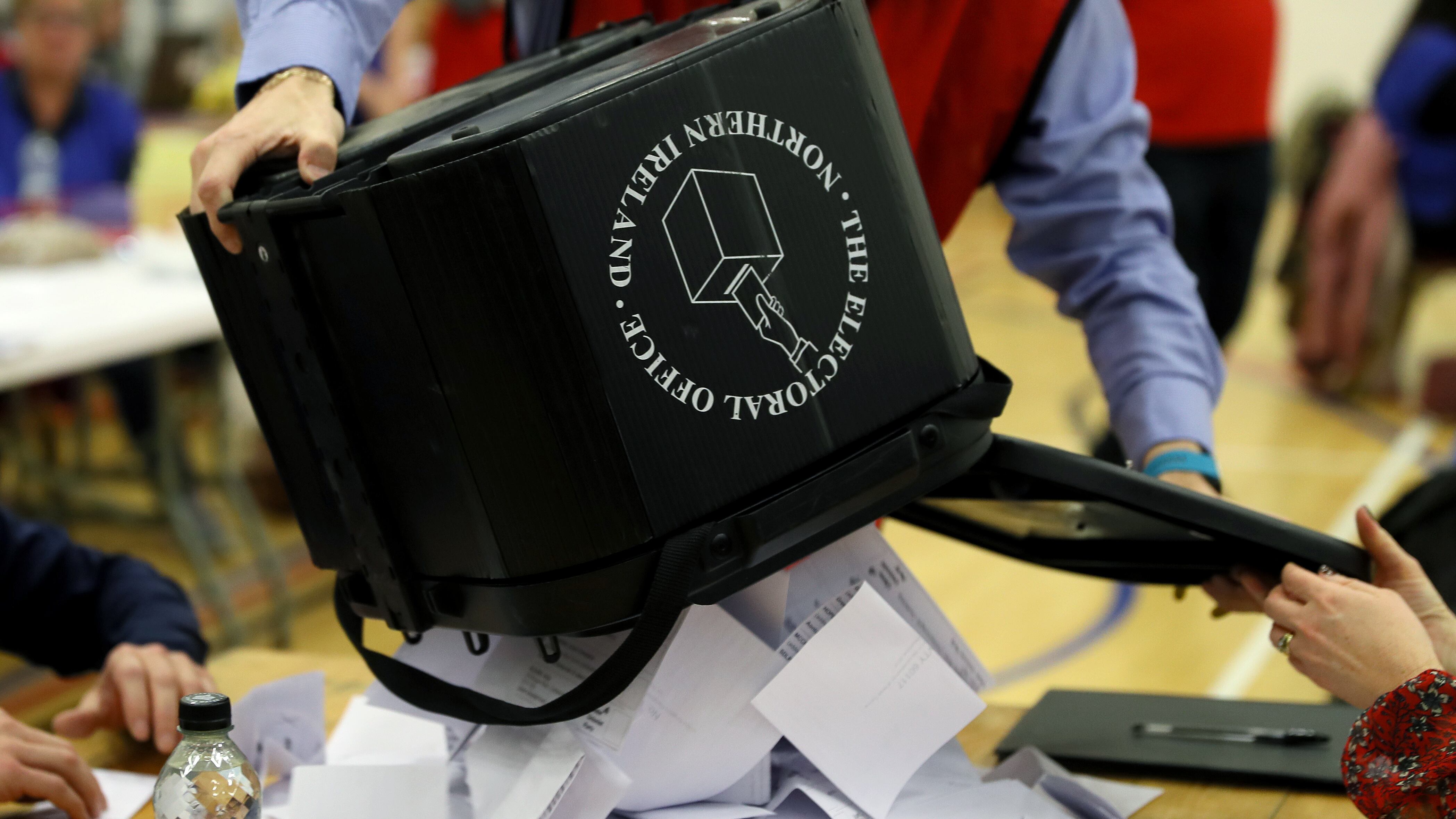 Ballot boxes are opened at in Omagh, Northern Ireland, during the 2019 general election