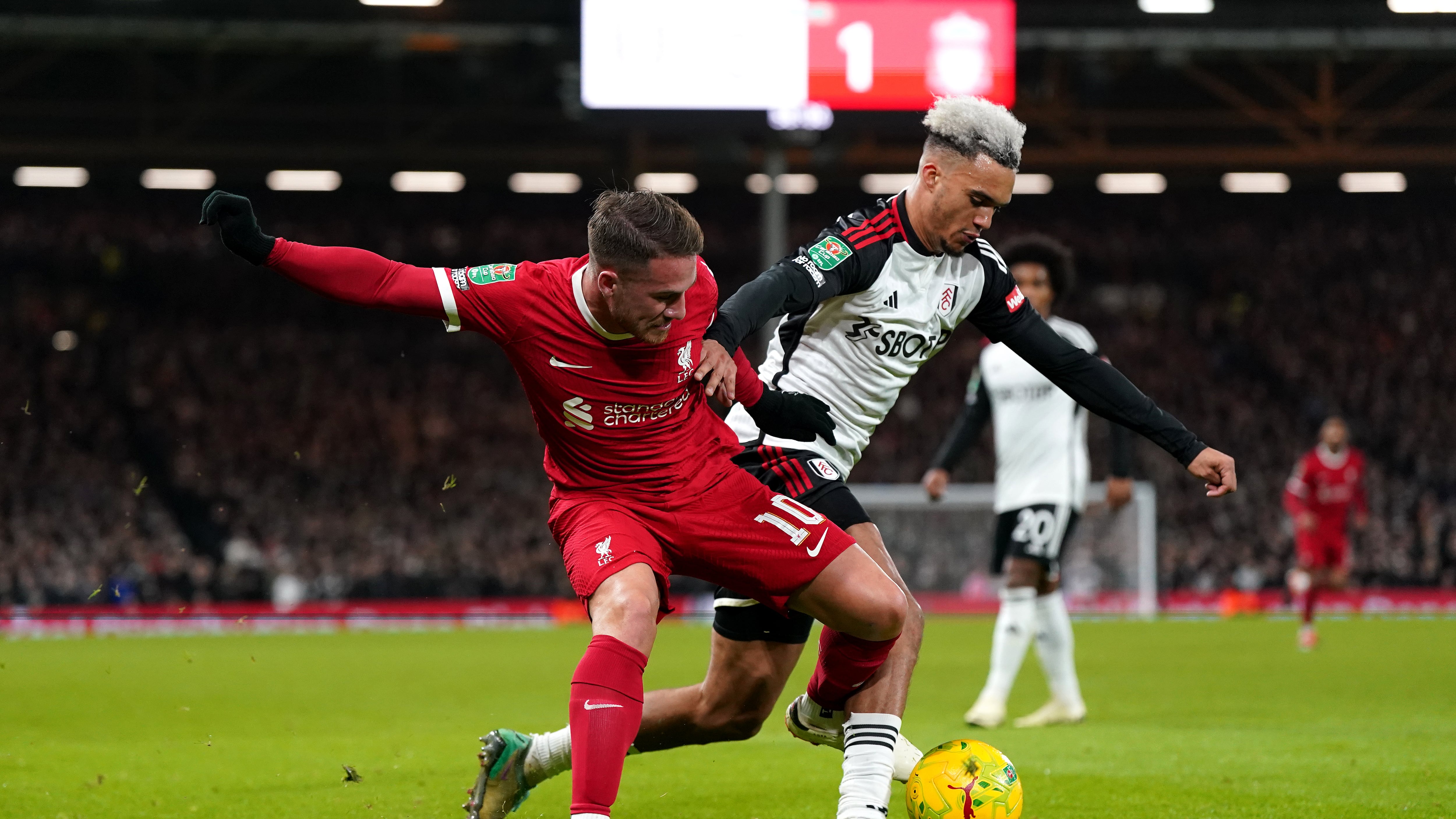 Liverpool’s Alexis Mac Allister (left) and Fulham’s Antonee Robinson battle for the ball during the Carabao Cup semi final second leg match at Craven Cottage, London. Picture date: Wednesday January 24, 2024.