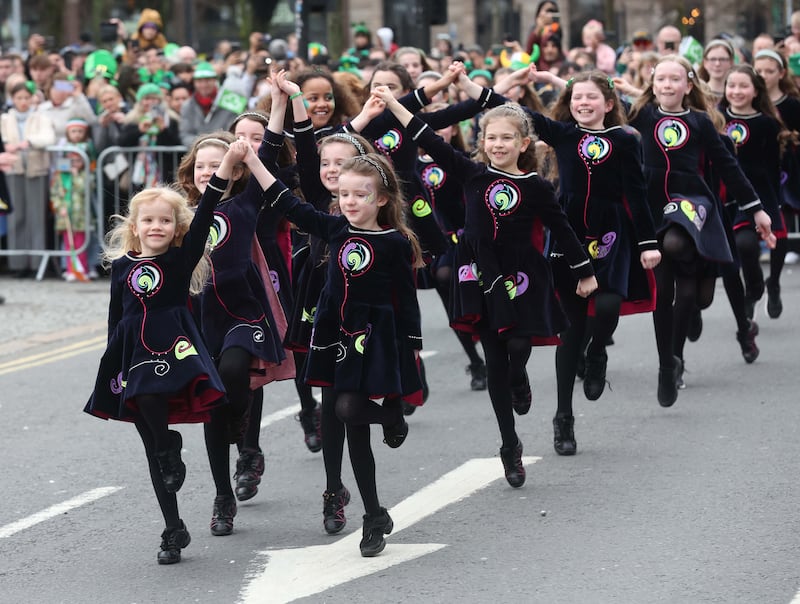 Performers entertain the crowd as  Thousands line the streets for the St Patrick’s day Parade in Belfast on Sunday.
PICTURE COLM LENAGHAN