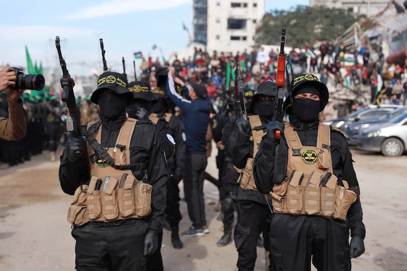 Hamas and Islamic Jihad fighters are deployed in central Gaza City ahead of the release of four Israeli female hostages (Abed Hajjar/AP)