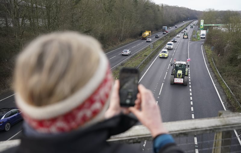 Farmers in tractors make their way along the A303 near Middleton, Hampshire during a national tractor rally organised by Farmers To Action