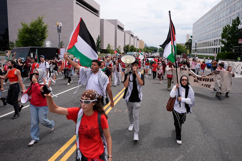 Demonstrators marching on Independence Avenue near the National Mall ahead of Israeli Prime Minister Benjamin Netanyahu’s visit to the US Capitol (AP Photo/Matt Slocum)