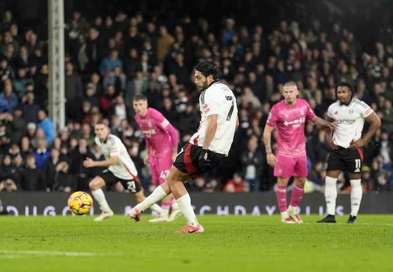 Raul Jimenez slotted in two penalties to help earn Fulham a point