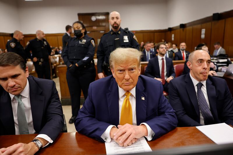 Former US president Donald Trump sits in the courtroom with lawyers Todd Blanche, left, and Emil Bove at Manhattan Criminal Court before his trial in New York (Michael M Santiago/Pool Photo via AP)