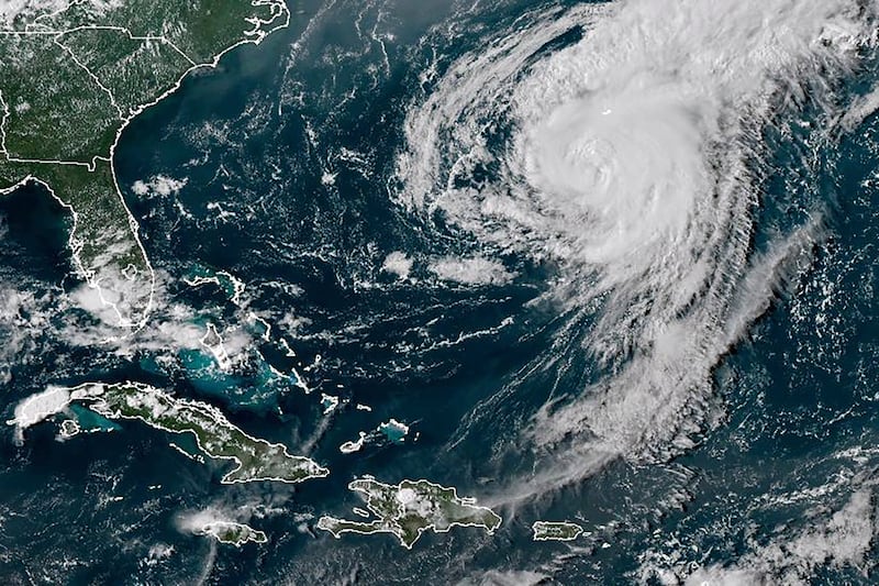 A satellite image shows Hurricane Ernesto in the Atlantic Ocean south-southwest of Bermuda on August 16 (NOAA via AP)