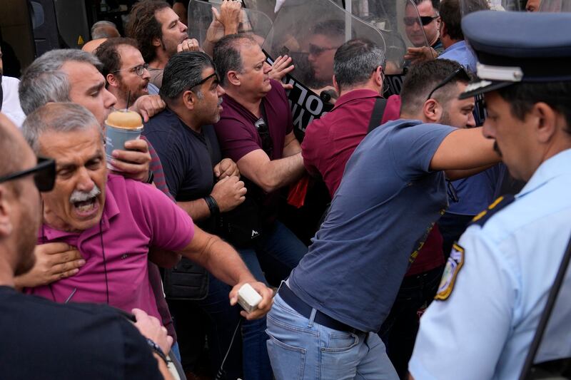 Protesters clashed with police outside the court (AP Photo/Thanassis Stavrakis)