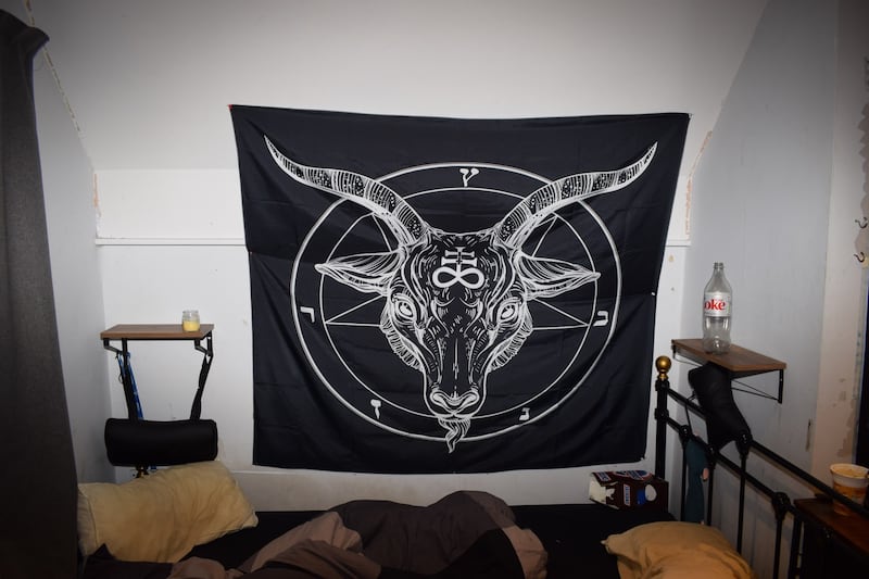 A satanist flag found in the house of Cameron Finnigan who has been jailed for six years