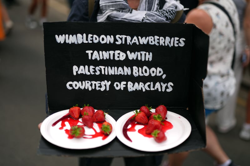 Protesters used Wimbledon’s famous strawberries in their demonstration