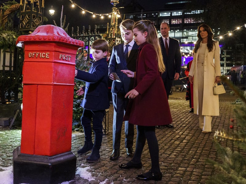 Before the 2023 service, William and Kate watched as Louis, George and Charlotte posted Christmas cards to children who may have been struggling last festive season