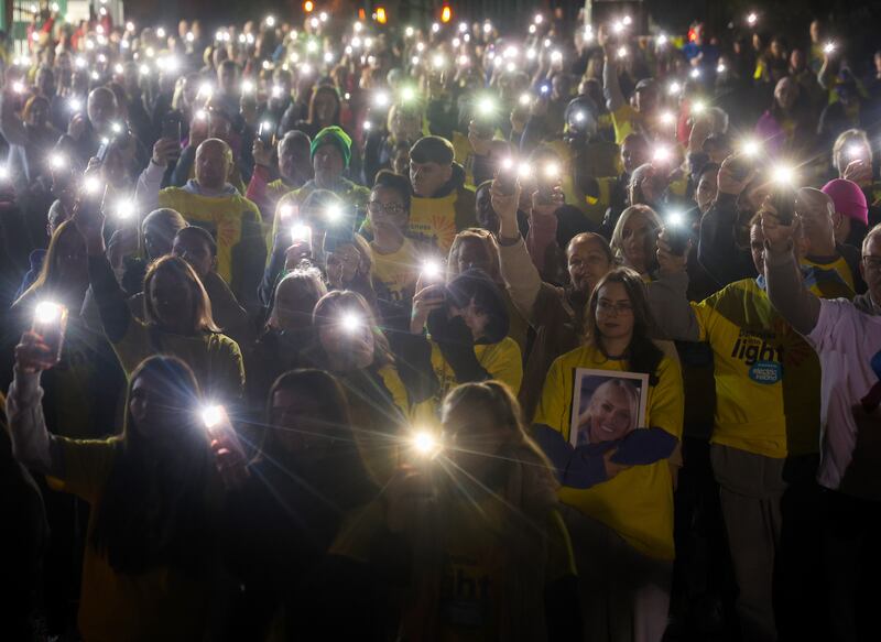 Family and friends take part into The Darkness Into Light 5k walk in memory of those who died by suicide from the Lamh Dhearg GAA club in west Belfast. PICTURE: MAL MCCANN