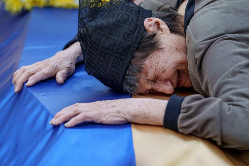 Ukrainians mourned their loved ones at the ceremony in Poltava (AP)