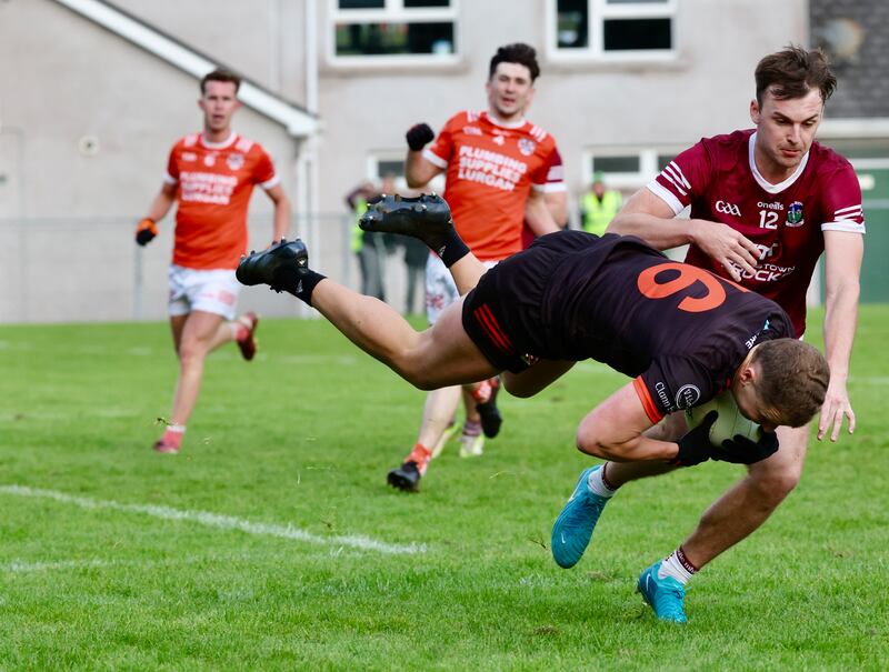 Ballymacnab’s Pearse Hughes  and  Clann Eireann’s Eoghan Mullholland   during Sunday’s game at Pearse Og Park.
PICTURE COLM LENAGHAN