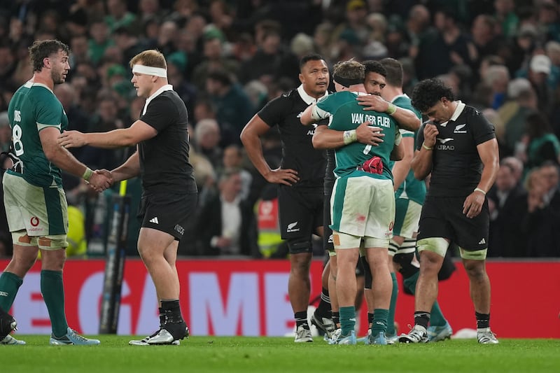 Ireland's Josh van der Flier (centre right) and New Zealand's Ardie Savea embrace after the Autumn international match at Aviva Stadium, Dublin. Picture date: Friday November 8, 2024.