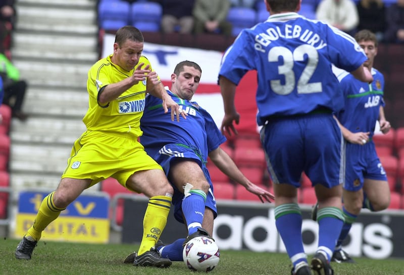 Paul Mitchell, second left, played professionally with clubs including Wigan and MK Dons