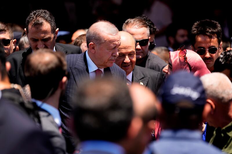 Mr Erdogan and Cypriot leader Ersin Tatar met the public in Nicosia (AP)