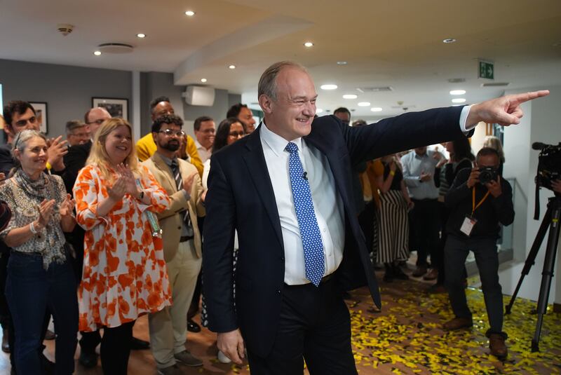 Liberal Democrat leader Sir Ed Davey is greeted by supporters as he returns to the party’s HQ in central London