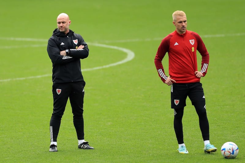 Wales manager Rob Page (left) is confident Ramsey (right) will play for his country again after fitness issues