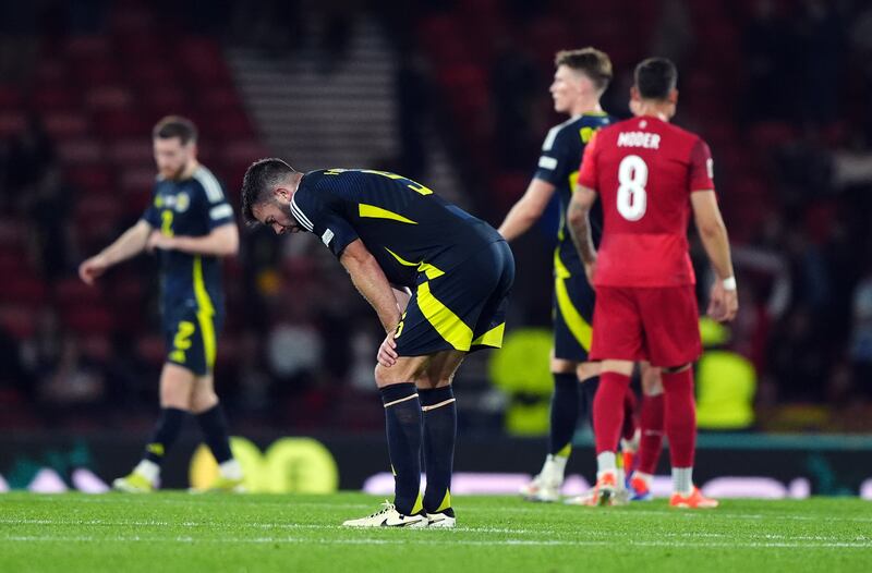 Scotland’s Grant Hanley stoops over in dejection