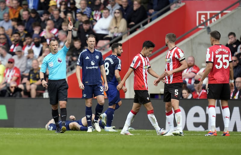 Stuart Attwell shows a red card to Southampton’s Jack Stephens