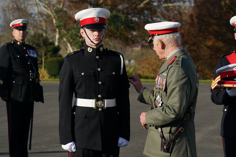 The King awards Marine Osian Stephens the King’s Badge