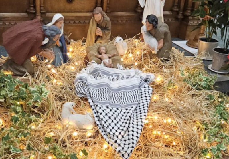 A Palestinian keffiyeh scarf displayed in a crib at St John's Church on Christmas Eve in west Belfast. PICTURE: GAELSAGAINSTGENOCIDE/X