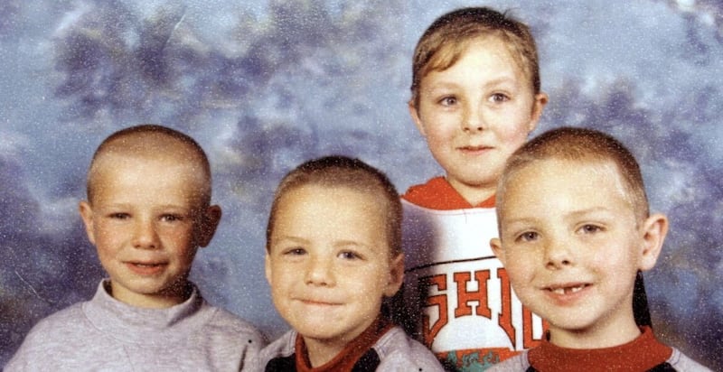 The Quinn brothers Richard (10), Mark (9) and Jason (8), died when a petrol bomb was thrown through the living room window of their home in Carnany estate in Ballymoney, on July 12 1998. Their older brother, Lee, pictured behind, survived as he was grandparents on the night of the attack