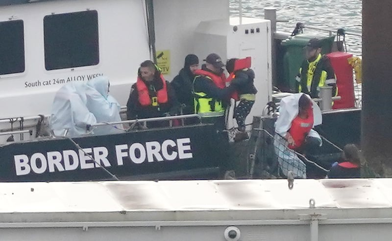 A group of people thought to be migrants are brought in to Dover, Kent