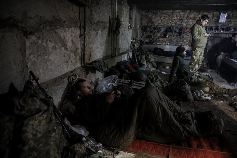 Servicemen have a short rest in a shelter on the front line near Chasiv Yar town in Ukraine’s Donetsk region (Ukraine 24th Mechanised Brigade via AP)