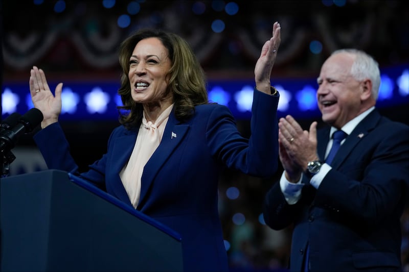 Kamala Harris and Tim Walz speak at a campaign rally in Philadelphia (Matt Rourke/AP)