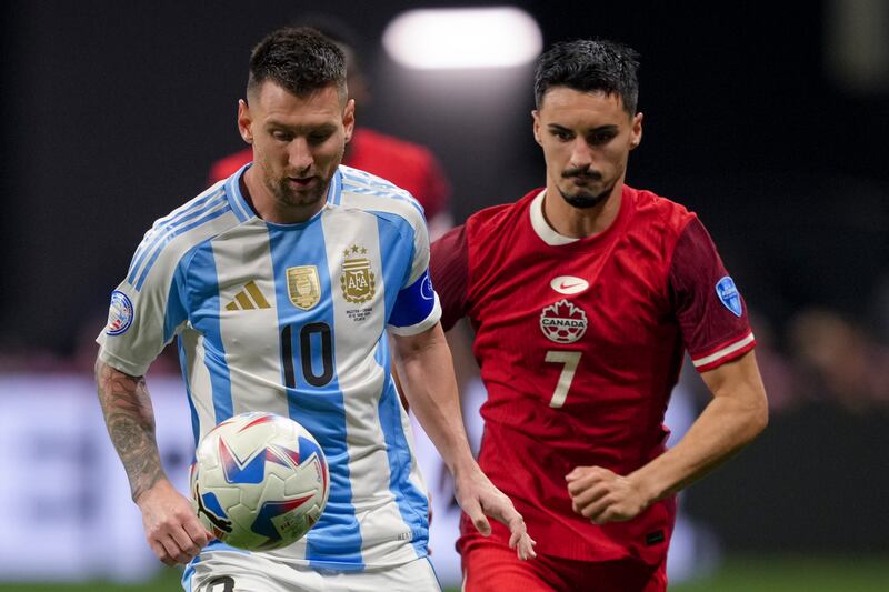 Lionel Messi, left, set up a goal for Argentina (Jason Allen/AP)
