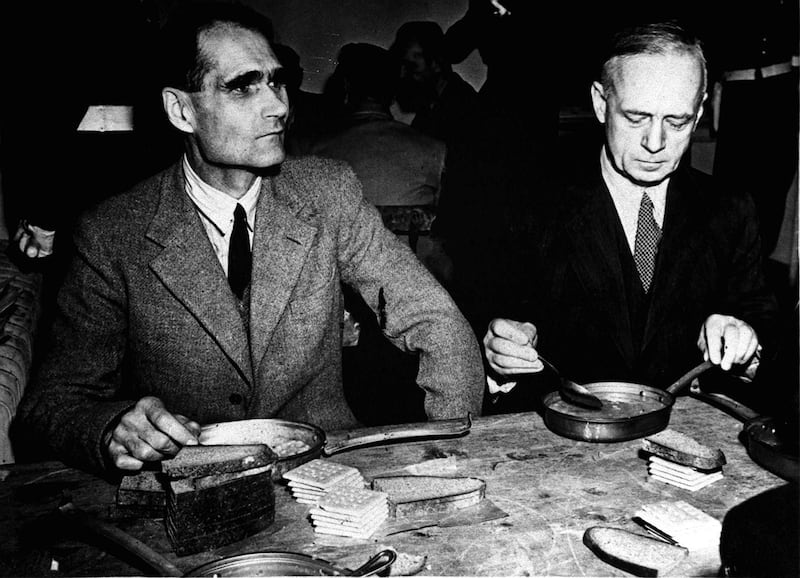 Former Deputy Fuhrer Rudolf Hess and German Foreign Minister Joachim Von Ribbentrop (right) during a meal at the Nuremberg Court House, Bavaria, during the post-Second World War trials of leading Nazis