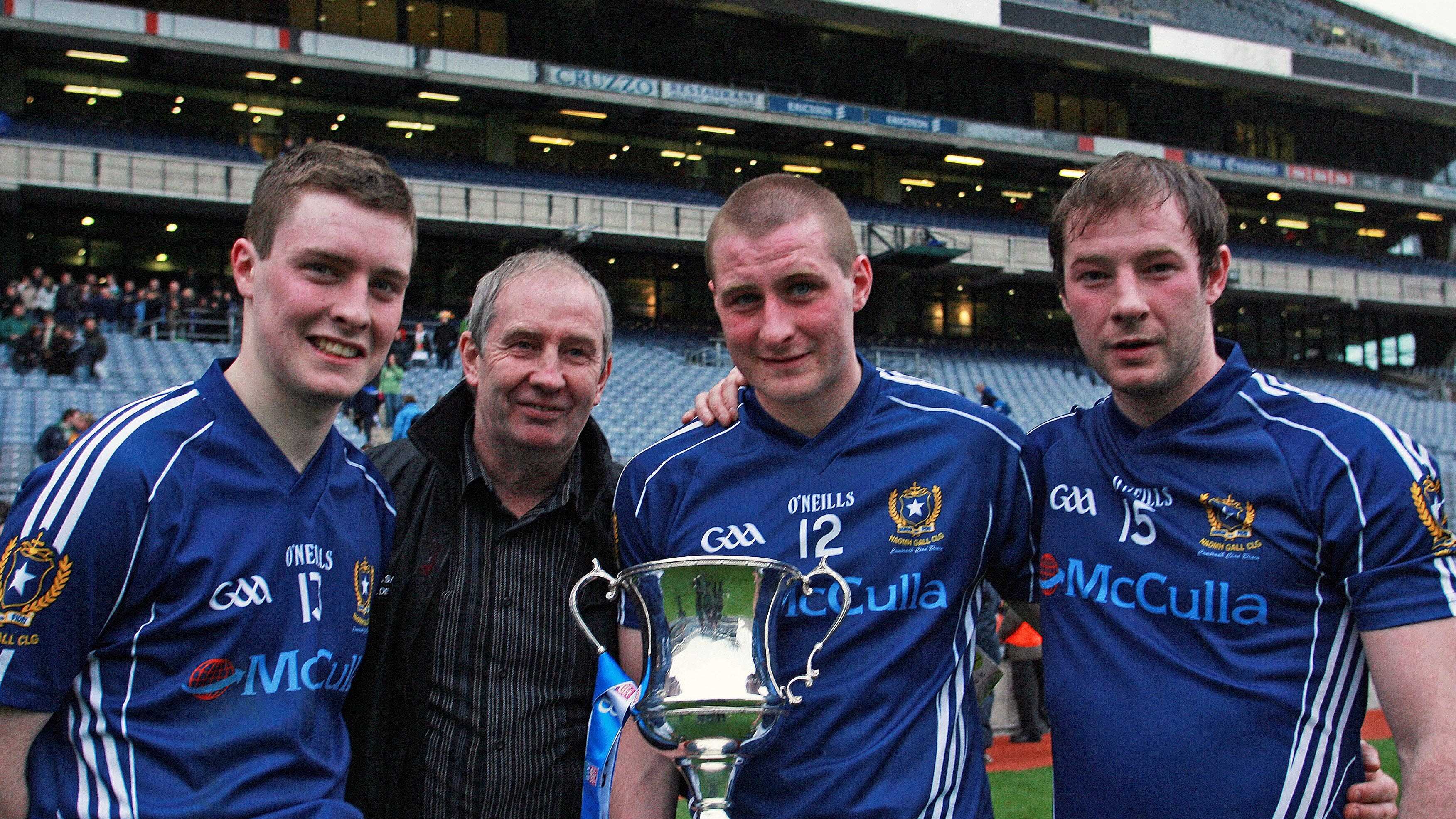 Proud father Sean McGourty with sons (l ro r) CJ, Kevin and Kieran after they helped St Gall's to the All-Ireland Club Football Championship trophy at Croke Park, Dublin on St Patrick's Day&nbsp;2010. Picture by Seamus Loughran&nbsp;