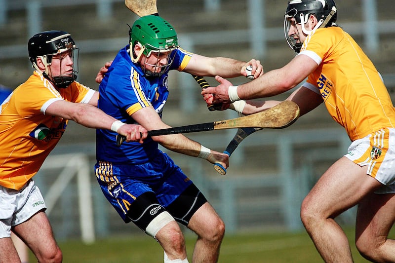 Antrim defenders Cormac Donnelly and Barry McFall block the path of Clare's Colin Ryan at Casement Park. Picture: Seamus Loughran