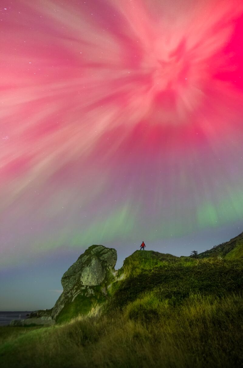 Alistair Hamill captures himself at Glenarm, Co Antrim during the October 2024 aurora borealis