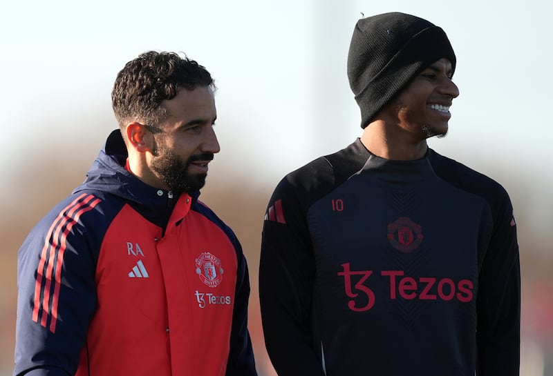 Manchester United manager Ruben Amorim with Marcus Rashford during a training session at Carrington training centre. Picture by PA