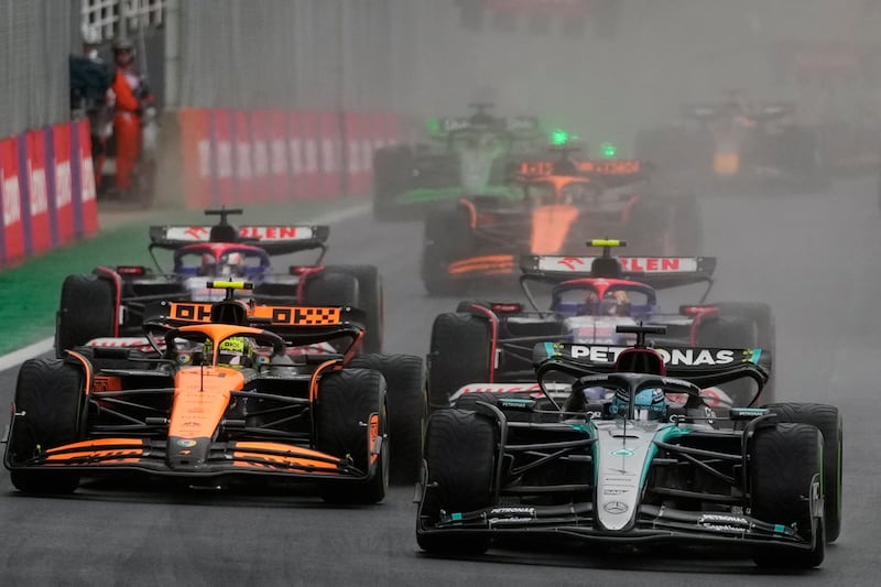 Lando Norris, left, lost the lead again at the start (AP Photo/Andre Penner)