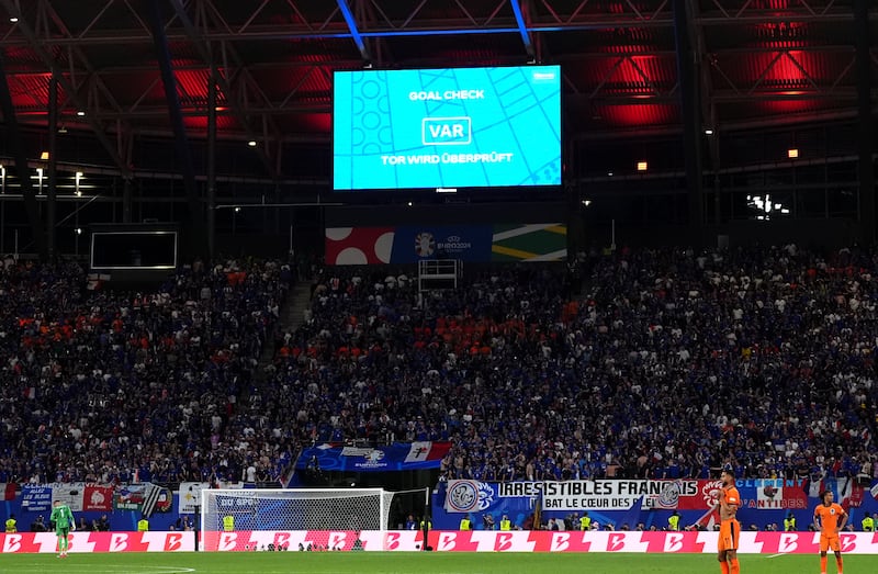 A large screen shows a VAR check which ruled out Xavi Simons’ strike in the second half for the Netherlands