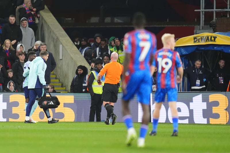 Bukayo Saka (left) went off injured at Selhurst Park .