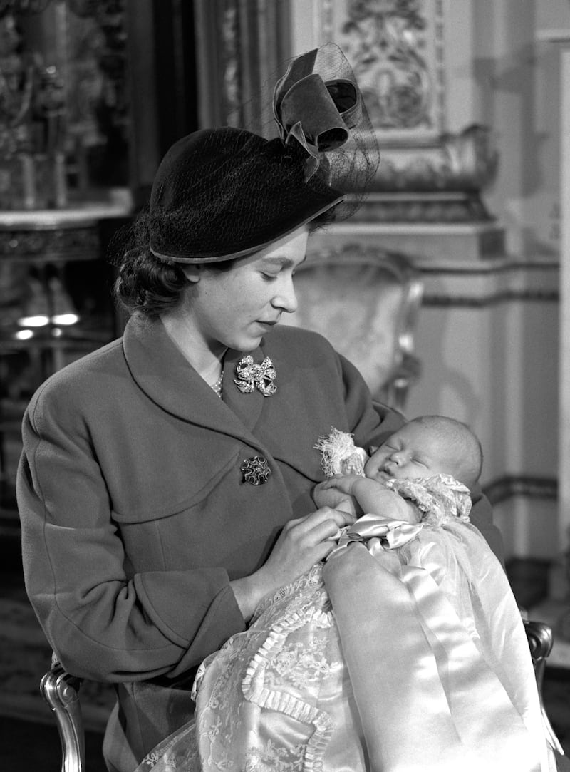 Princess Elizabeth holds her first born Prince Charles after his christening in 1948