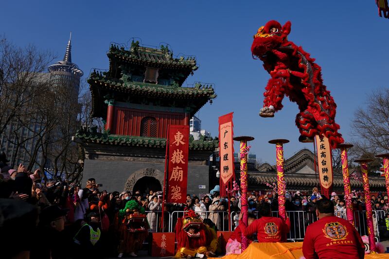 Acrobatic lion dances are a popular feature of the celebrations (AP)