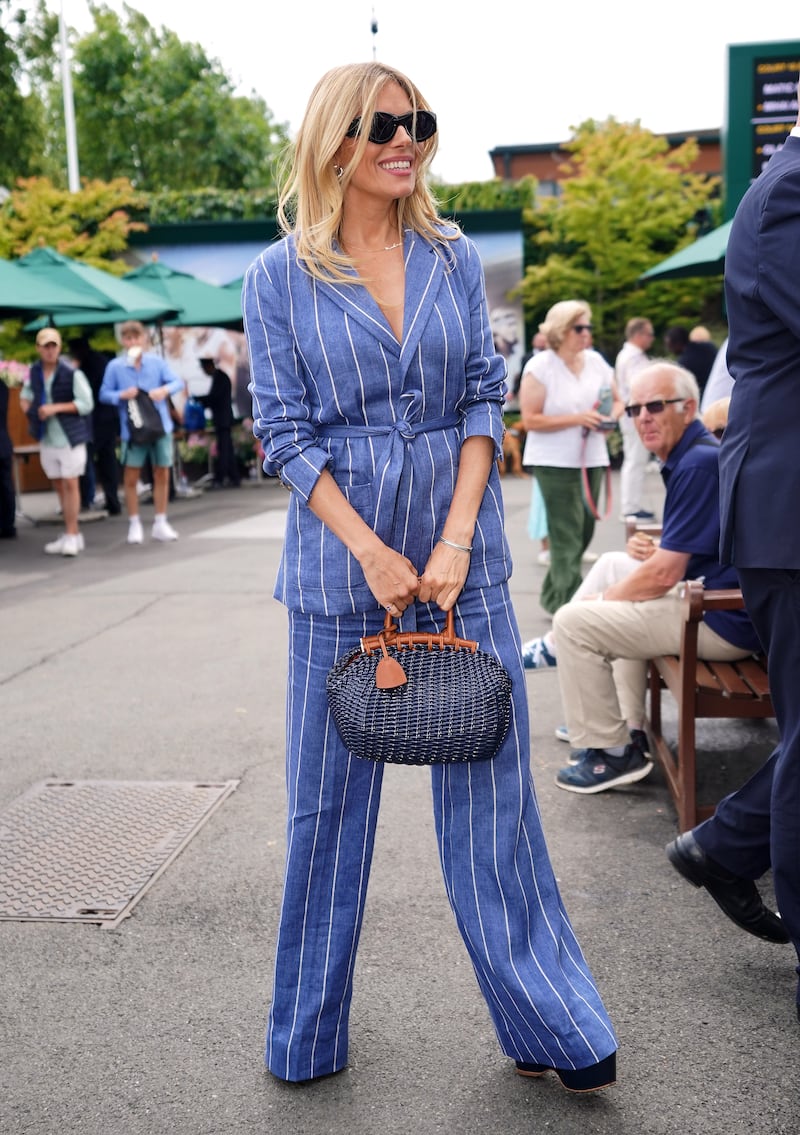 Sienna Miller wore a denim-coloured linen suit for Wimbledon, 2023