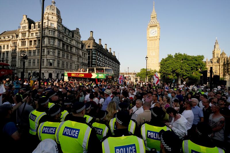 People attending the Enough is Enough protest in Parliament Square, London, following the fatal stabbing of three children at a Taylor Swift-themed holiday club on Monday in Southport