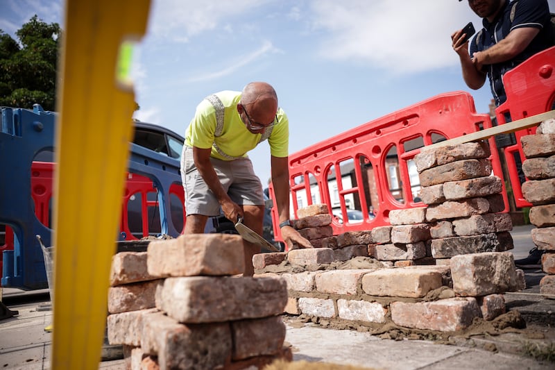 Local tradesmen rebuilt walls outside the mosque in Southport after the protests