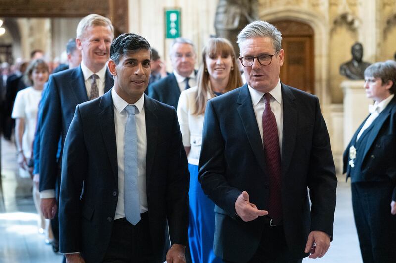 Prime Minister Sir Keir Starmer and Leader of the Opposition Rishi Sunak walk through the Member’s Lobby of the Houses of Parliament to the House of Lords to hear the King’s Speech