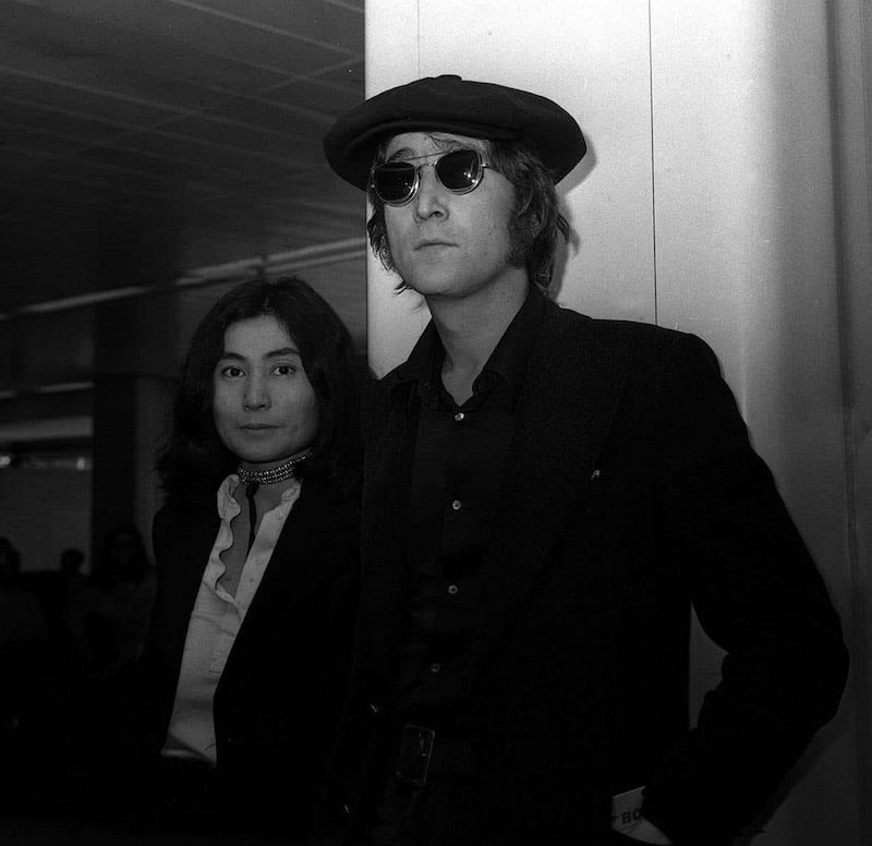 Former Beatle John Lennon arrives at London Heathrow from New York with his wife, Yoko Ono in 1971